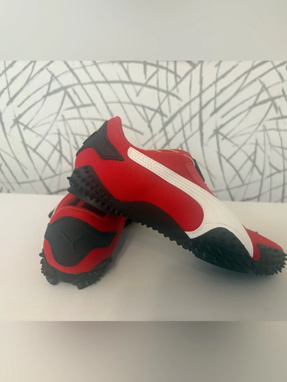 PUMA Mostro OG Sneakers. Vibrant  Red with a Unique Spike Sole.